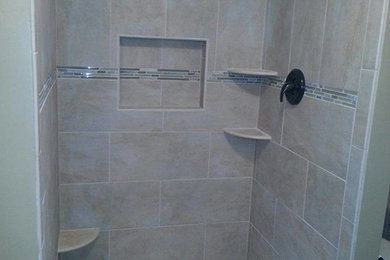 Inspiration for a mid-sized timeless master beige tile and ceramic tile bathroom remodel in San Diego with beige walls