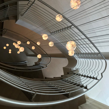 Curved Staircase with Custom Metal Railing
