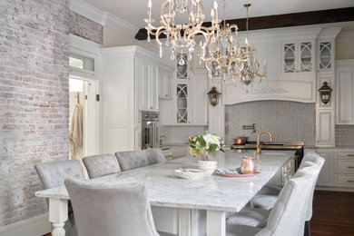Example of a french country kitchen design in Nashville with an integrated sink and an island