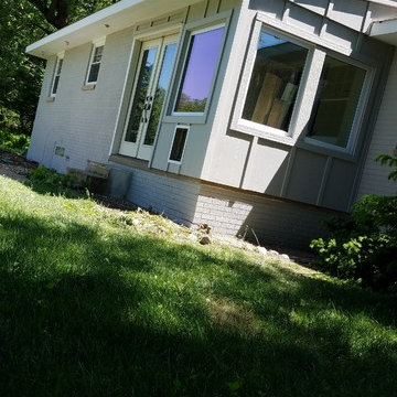 Brick painting, new windows, James hardie siding, fascia and soffit (pearl gray)