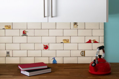 Example of a 1960s kitchen design in Detroit with ceramic backsplash