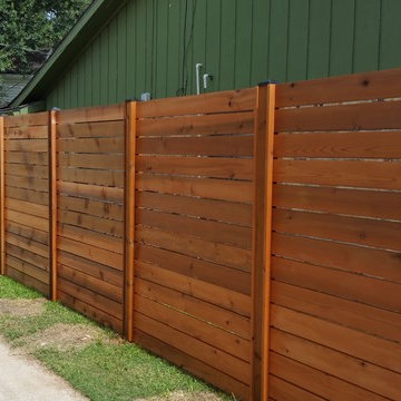 Custom Horizontal cedar fence with automatic swing gate