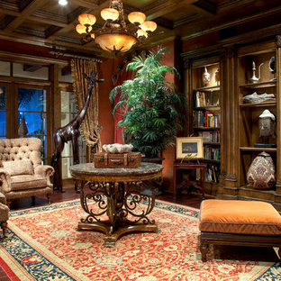 Diseño de salón para visitas cerrado, mediterráneo, grande, sin chimenea y televisor, con paredes rojas y suelo de madera oscura