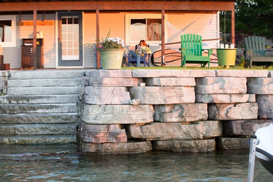 Example of a mid-sized trendy backyard concrete patio design in Other with a fire pit