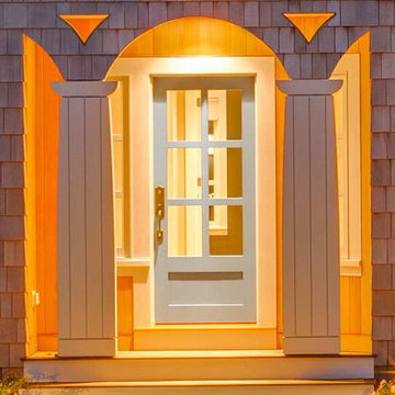 Flat “carpenter’s” columns & Shingled Arched Doorway - Sea Change - Custom Home