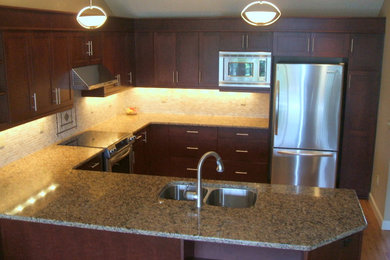 Example of a mid-sized arts and crafts kitchen design in Portland