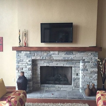 Custom wood mantle with gray cultured stone