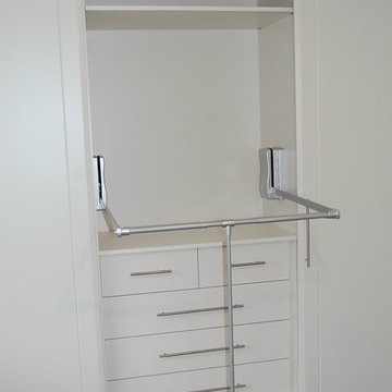 Sliding wardrobe with pull down clothes rail shelving and drawers