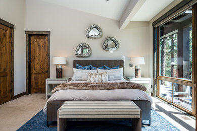 Inspiration for a rustic master carpeted and beige floor bedroom remodel in Other with gray walls and no fireplace