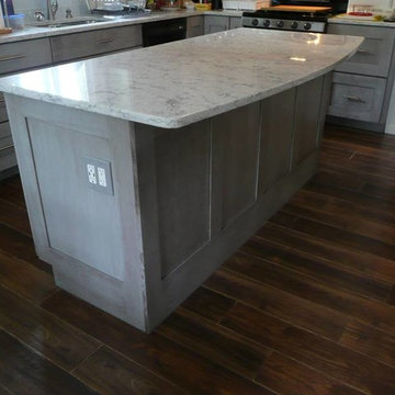 Medallion Cherry Peppercorn Cabinets with Rococo Quartz countertops