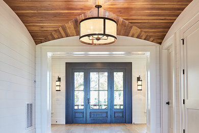 Huge beach style entryway photo in Charleston