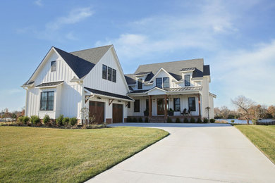 Example of a farmhouse exterior home design in Other