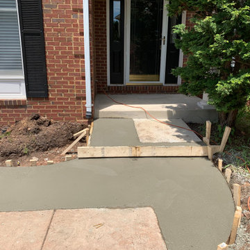 Limestone walkway with brick ascent to match house