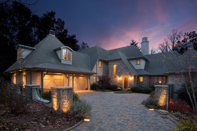 Example of a large farmhouse gray two-story exterior home design in Other