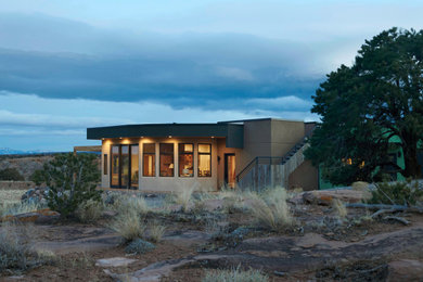 Example of an eclectic brown one-story mixed siding exterior home design in Salt Lake City