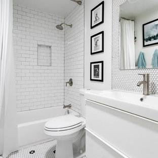 Trendy 3/4 white tile and mosaic tile mosaic tile floor and white floor bathroom photo in Austin with flat-panel cabinets, white cabinets, a two-piece toilet, white walls and a console sink