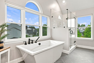 Inspiration for a large transitional master porcelain tile and gray floor bathroom remodel in Philadelphia with gray walls, a hinged shower door and a niche