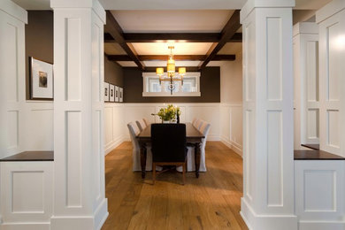 Inspiration for a large traditional separate dining room in Calgary with brown walls, no fireplace and light hardwood floors.