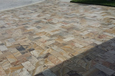 Large minimalist travertine floor entryway photo in Tampa