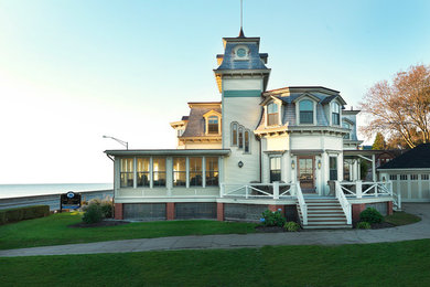 Large traditional gray two-story wood house exterior idea in Providence with a gambrel roof and a shingle roof