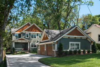 Large craftsman green two-story concrete fiberboard exterior home idea in Nashville with a shingle roof