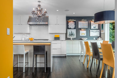 Kitchen/dining room combo - mid-sized contemporary dark wood floor kitchen/dining room combo idea in Seattle with gray walls and no fireplace