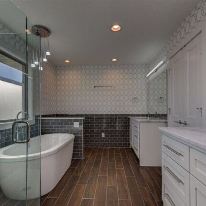 Bathroom - large contemporary master brown floor bathroom idea in Other with shaker cabinets, white cabinets, marble countertops, a one-piece toilet, an undermount sink and a hinged shower door