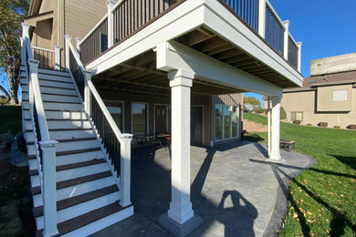 Deck - mid-sized craftsman backyard second story mixed material railing deck idea in Omaha with no cover