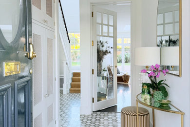 Design ideas for a medium sized traditional hallway in Other with white walls, marble flooring, grey floors and a grey front door.