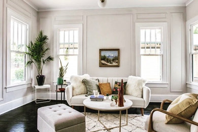 Inspiration for a mid-sized craftsman formal and open concept painted wood floor and black floor living room remodel in Los Angeles with gray walls and a standard fireplace