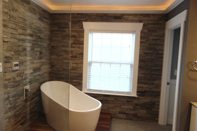 Custom Bathroom with Soaker Tub and Stacked Stone Walls