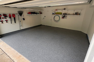 Example of an arts and crafts two-car garage design in Austin