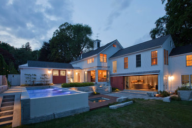 Example of a farmhouse exterior home design in Boston