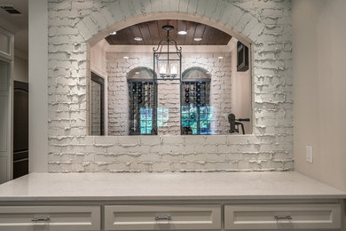 Inspiration for a mid-sized transitional ceramic tile wine cellar remodel in Atlanta