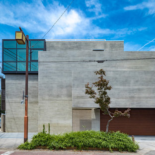 名古屋のモダンスタイルのおしゃれな家の外観 (石材サイディング、グレーの外壁) の写真