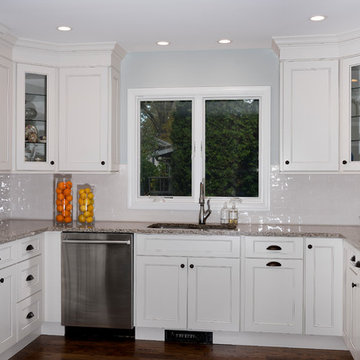 A modern Fusion Blanc kitchen with a built in coffee station