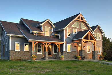 Example of a large classic blue two-story exterior home design in Kansas City