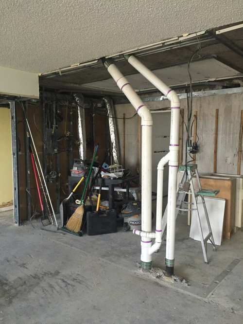 How to cover exposed kitchen pipes help!