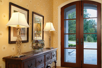 Entryway - mid-sized transitional entryway idea in Other with beige walls and a dark wood front door