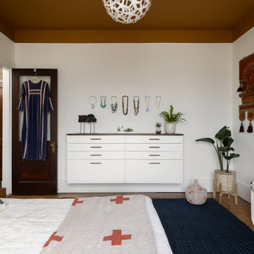 Eclectic White Bedroom with Floating Storage