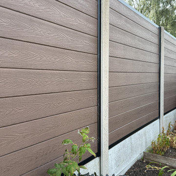 Composite Fence Boards Fitted Into Concrete Posts