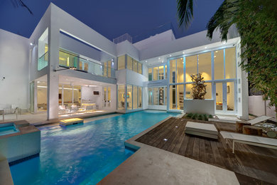 Huge modern two-story exterior home idea in Other