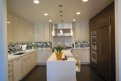 Inspiration for a small modern u-shaped porcelain tile enclosed kitchen remodel in Miami with an undermount sink, flat-panel cabinets, white cabinets, quartzite countertops, multicolored backsplash, glass tile backsplash and an island