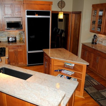 Stacked Stone Tile Backsplash and Millennium Cream Granite