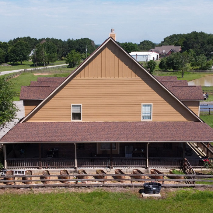 Hardie siding replacing brick on ranch house.