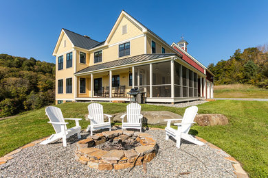 Farmhouse home design photo in Burlington