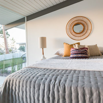Target Rattan Mirror Over Bed in Palm Springs Style Bedroom