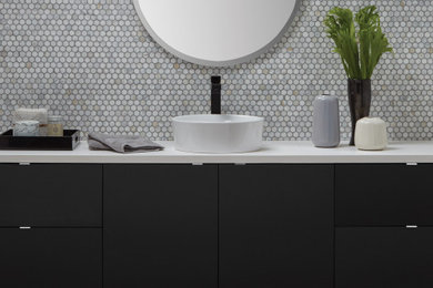 Inspiration for a mid-sized modern master mosaic tile black floor and single-sink bathroom remodel with black cabinets, a vessel sink, quartz countertops, white countertops and a floating vanity