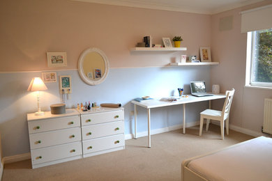 Example of a large country carpeted bedroom design in London with multicolored walls