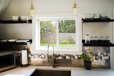 Kitchen - small traditional kitchen idea in Detroit with an undermount sink, quartz countertops, metallic backsplash, metal backsplash and white countertops
